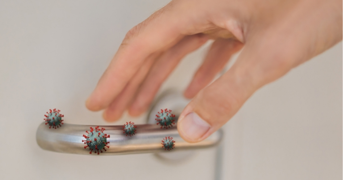 Illustration of virus particles on a door handle, showing a cross-contamination risk covered by OSHA dental compliance guidance