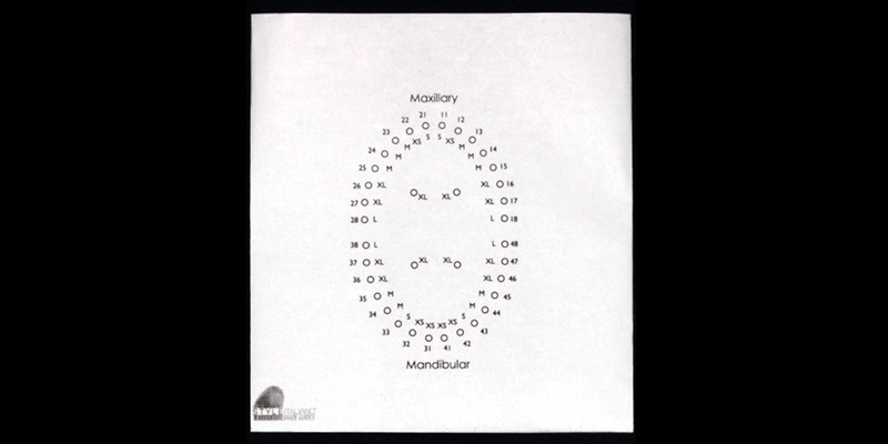 efrver Stock rubber dam template used to mark punch hole locations before isolating multiple teeth.