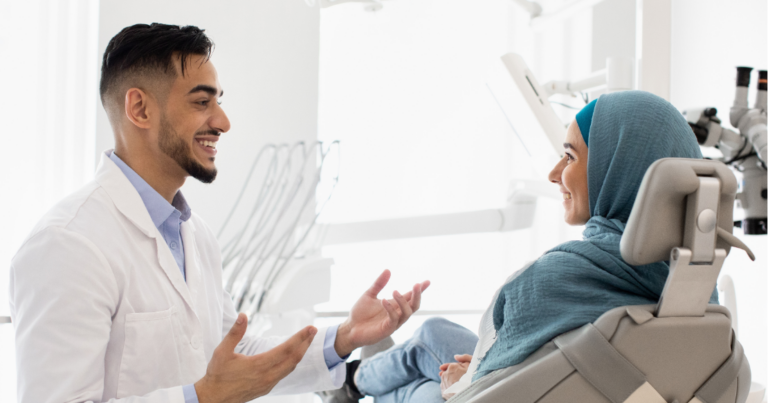 Dentist using dental case acceptance communication during a patient conversation
