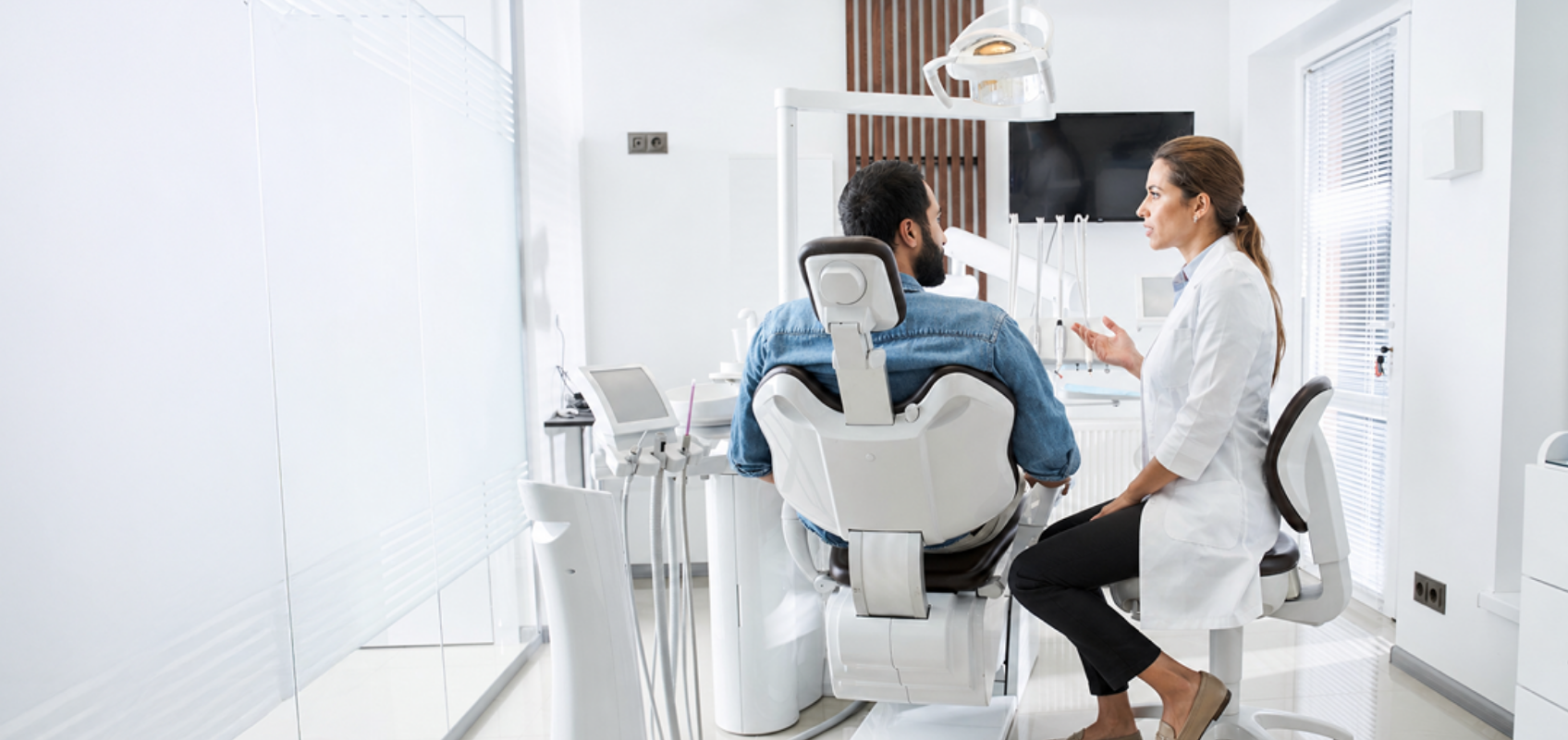 efrver Dentist explaining treatment options to a patient during a dental case acceptance communication conversation