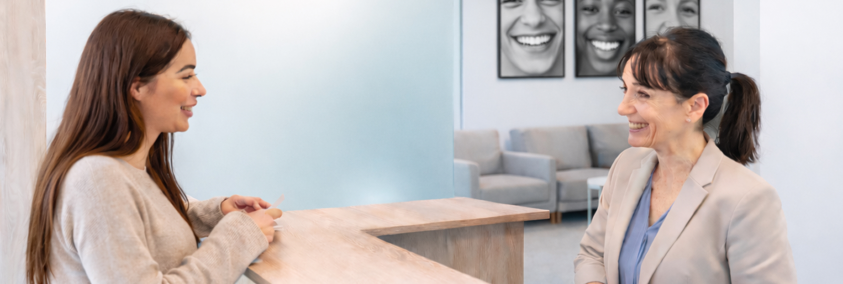 Dental front desk team explaining appointment as a reservation to prevent dental no-shows