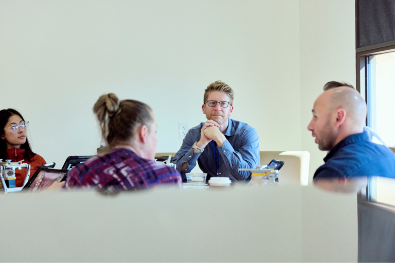 Dental professionals participating in a collaborative leadership meeting during a chief clinical officer training program focused on clinical strategy and team development.