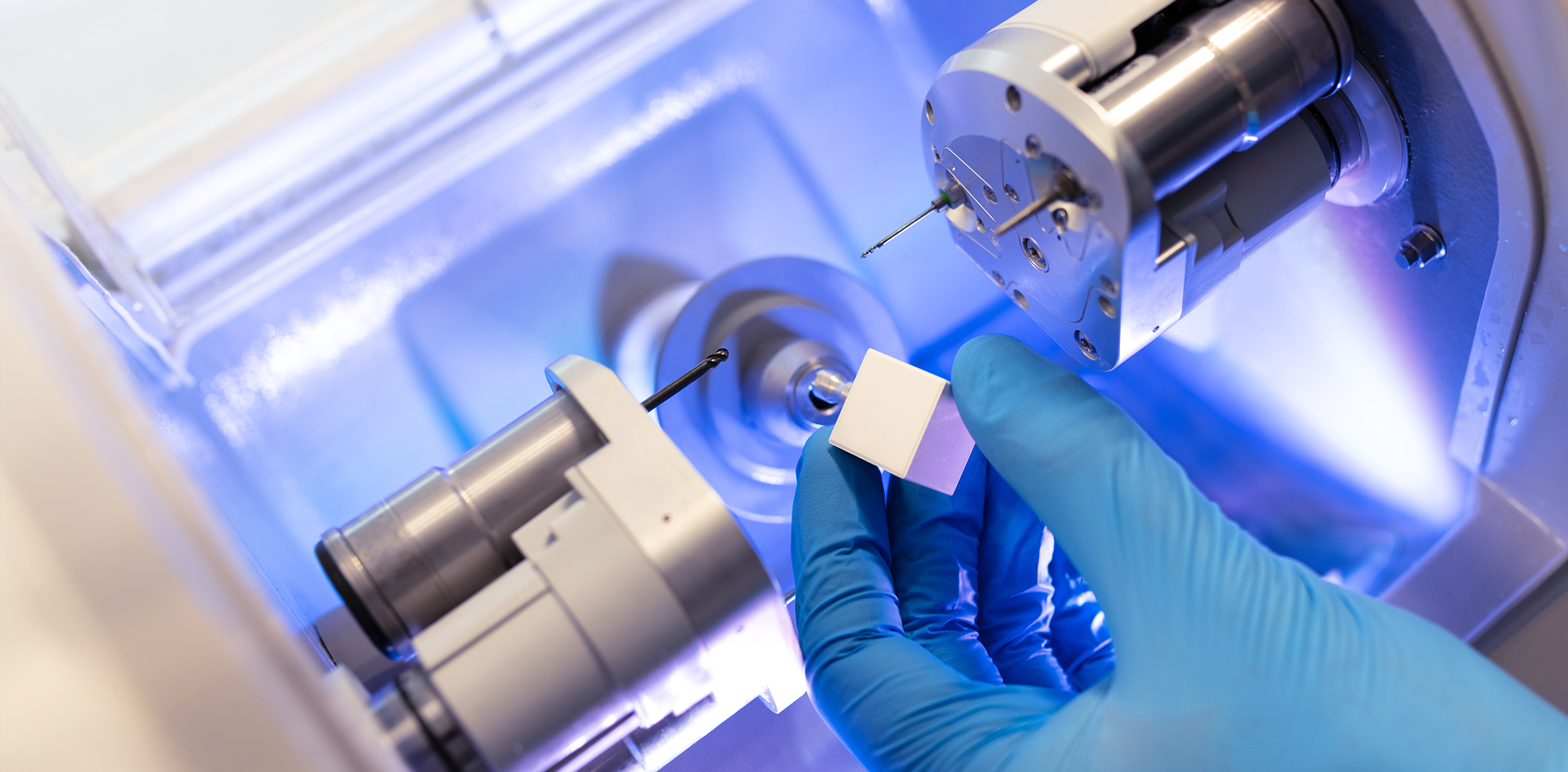 Dental professional using CAD/CAM milling technology to fabricate a restoration, supporting clinical growth in DSOs through standardized workflows, technology adoption, and clinical consistency.
