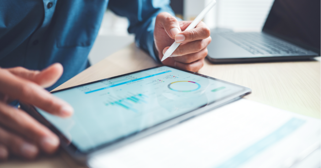 Dental Practice Cash Flow: Effective Strategies for Every Season Dental practice owner reviewing a financial performance dashboard to monitor dental practice cash flow, revenue trends, and key business metrics.