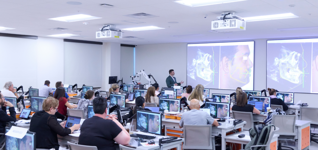DSO Growth Strategy: The Future is Bright, But Value Levers are Changing Dentists in a hands-on classroom session supporting DSO growth strategy through in-person clinical training