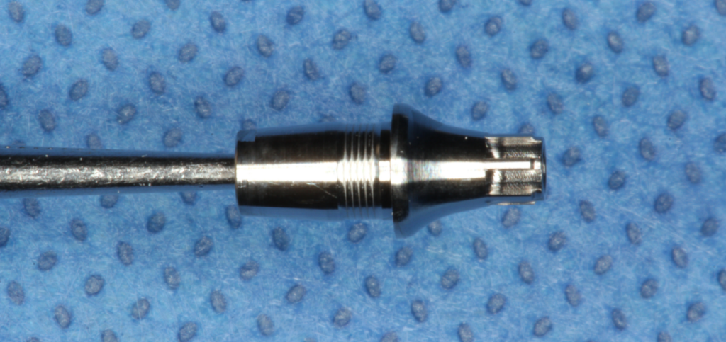 Titanium base used for the custom healing abutment.