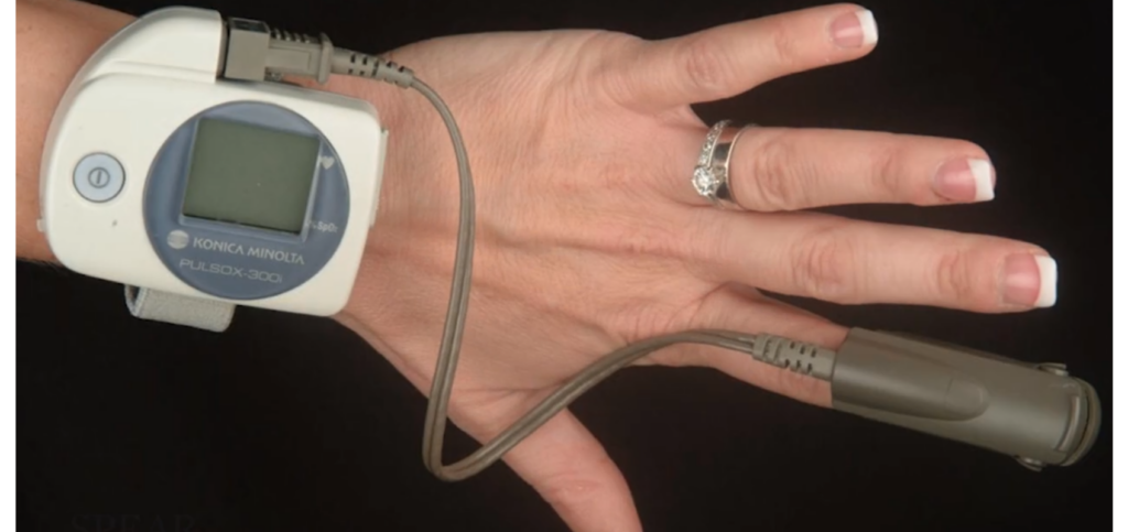 A wrist-worn pulse oximeter and finger clip, the type of screening device once central to the dentist’s role in airway health before exam-based screening took over.